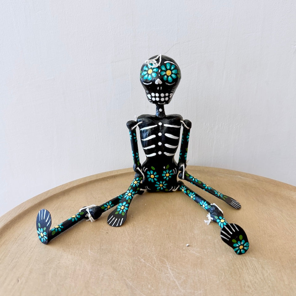 Black Paper Mache Skeleton With Flowers