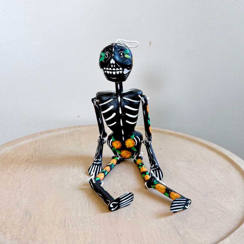 Black Paper Mache Skeleton With Marigold