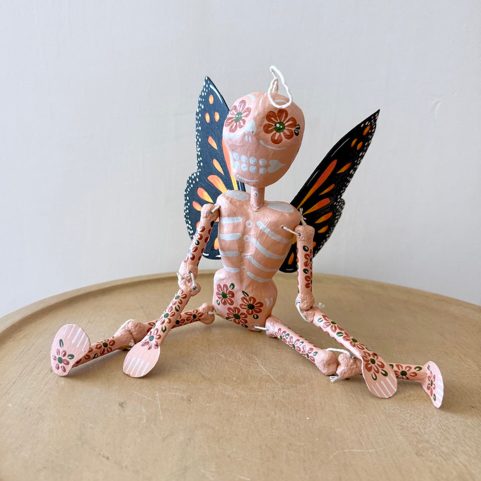 Light Pink Skeleton with Monarch Butterfly Wings