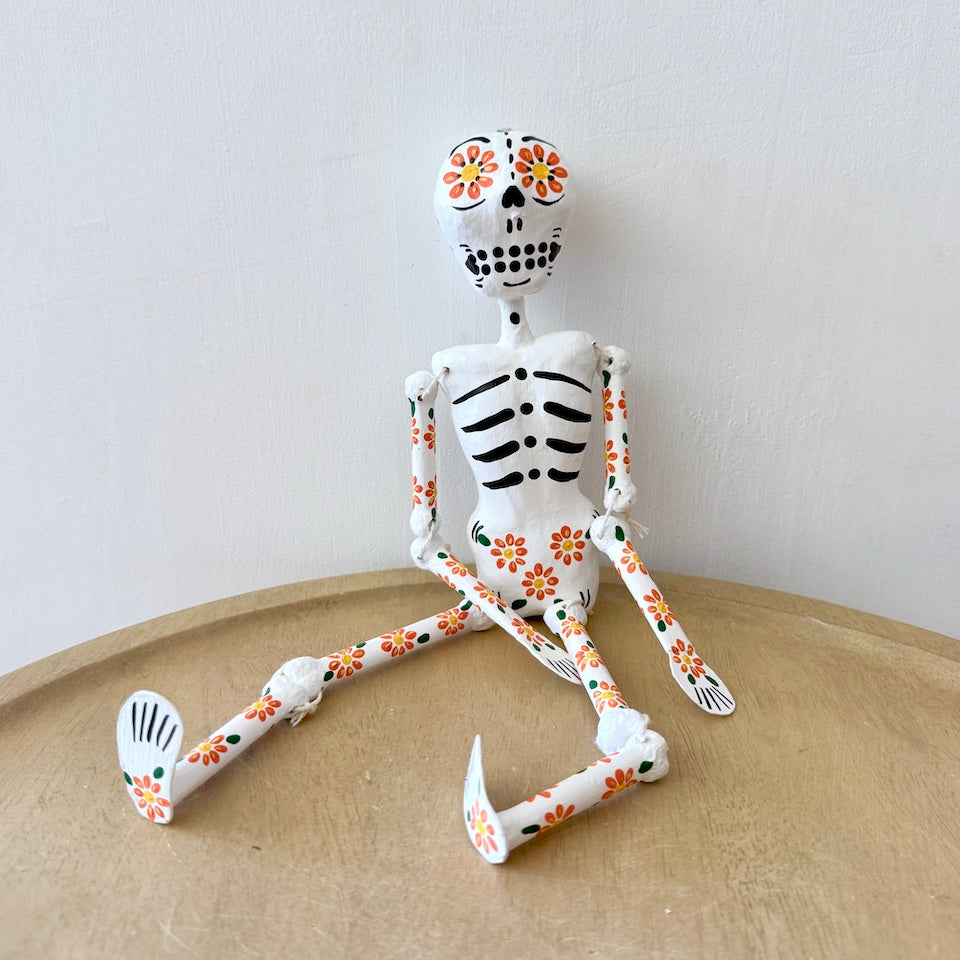 White Paper Mache Skeleton with Orange Flowers